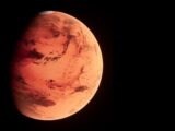 a red planet with a black background