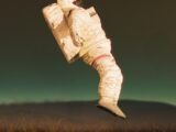 a man in a space suit flying through the air