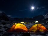 yellow dome tent on snow covered ground during night time