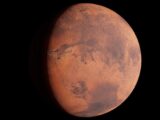 A high-resolution image capturing Mars with its surface details visible in space.