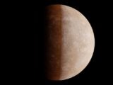 Detailed photo of Mercury's surface with visible craters against black space.