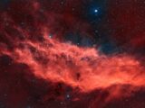 Red nebula and stars in deep space