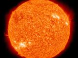Detailed image of the sun showcasing its fiery surface and glowing edges.
