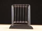 black and silver chess pieces on black tray