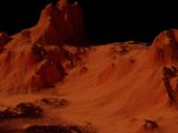 a group of mountains covered in sand at night