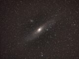 The andromeda galaxy surrounded by stars