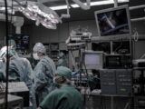 people wearing surgical clothes inside operating room