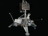 A complex scientific instrument against a black background.
