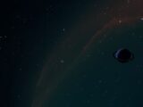 A breathtaking celestial scene featuring a distant ringed planet set against a night sky filled with stars.