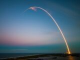 rocket launch light trail at dusk