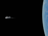 A satellite orbiting Earth amidst the vastness of space, capturing the planet's beauty.