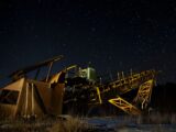 brown and black metal crane under starry night