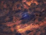 Wide view of a colorful cosmic nebula and stars, creating a mesmerizing celestial scene.